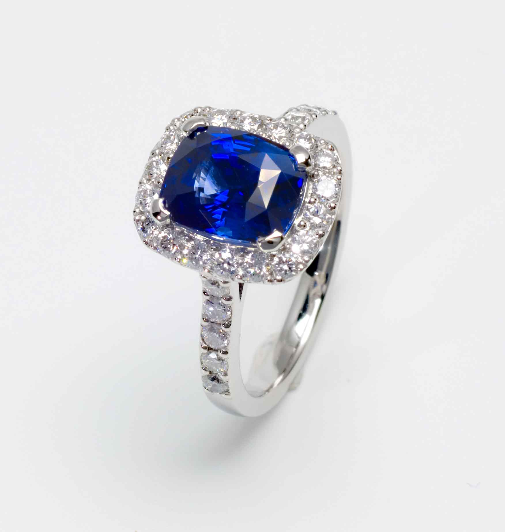 Blue sapphire cushion and diamond engagement ring