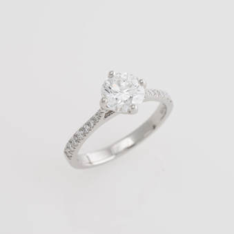 Solitaire Engagement Ring with diamond set shoulders castle set platinum